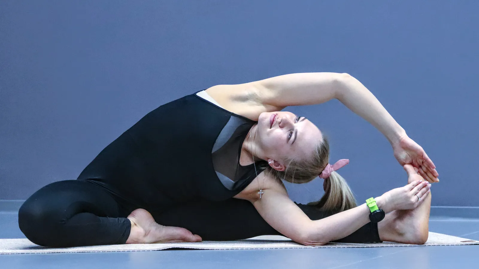 Woman performing a stretching pose during a fitness session