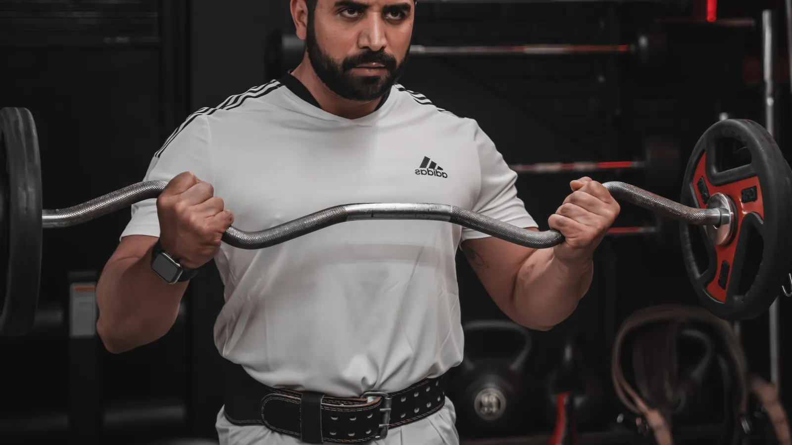 Person training arms with dumbbells