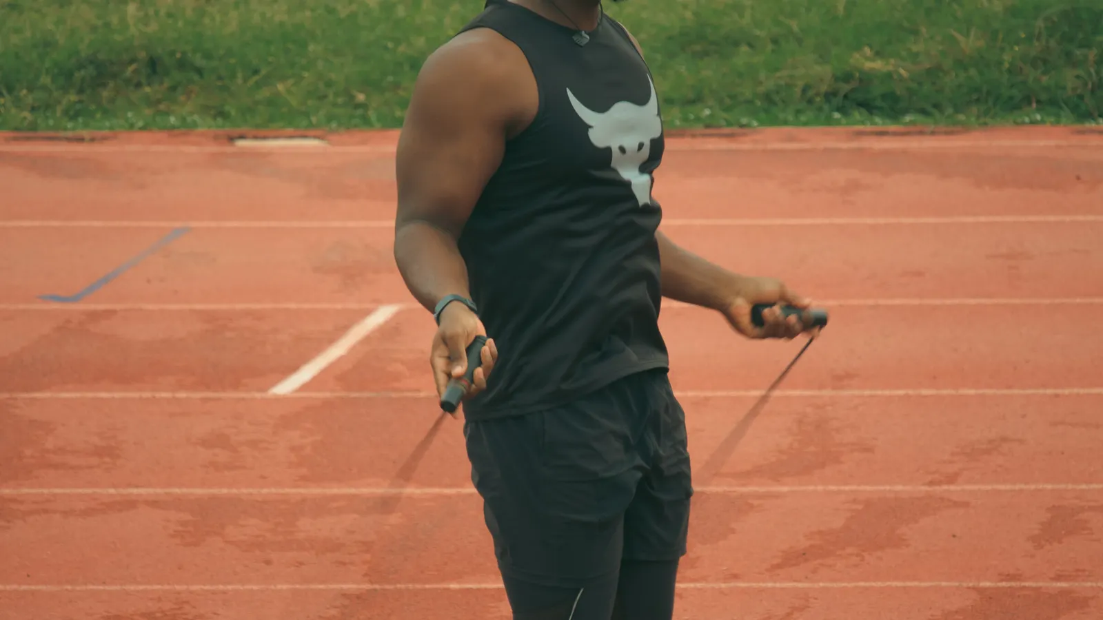 Man jumping rope on an outdoor track