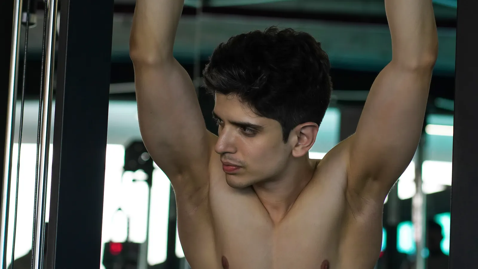 Person training legs on gym equipment