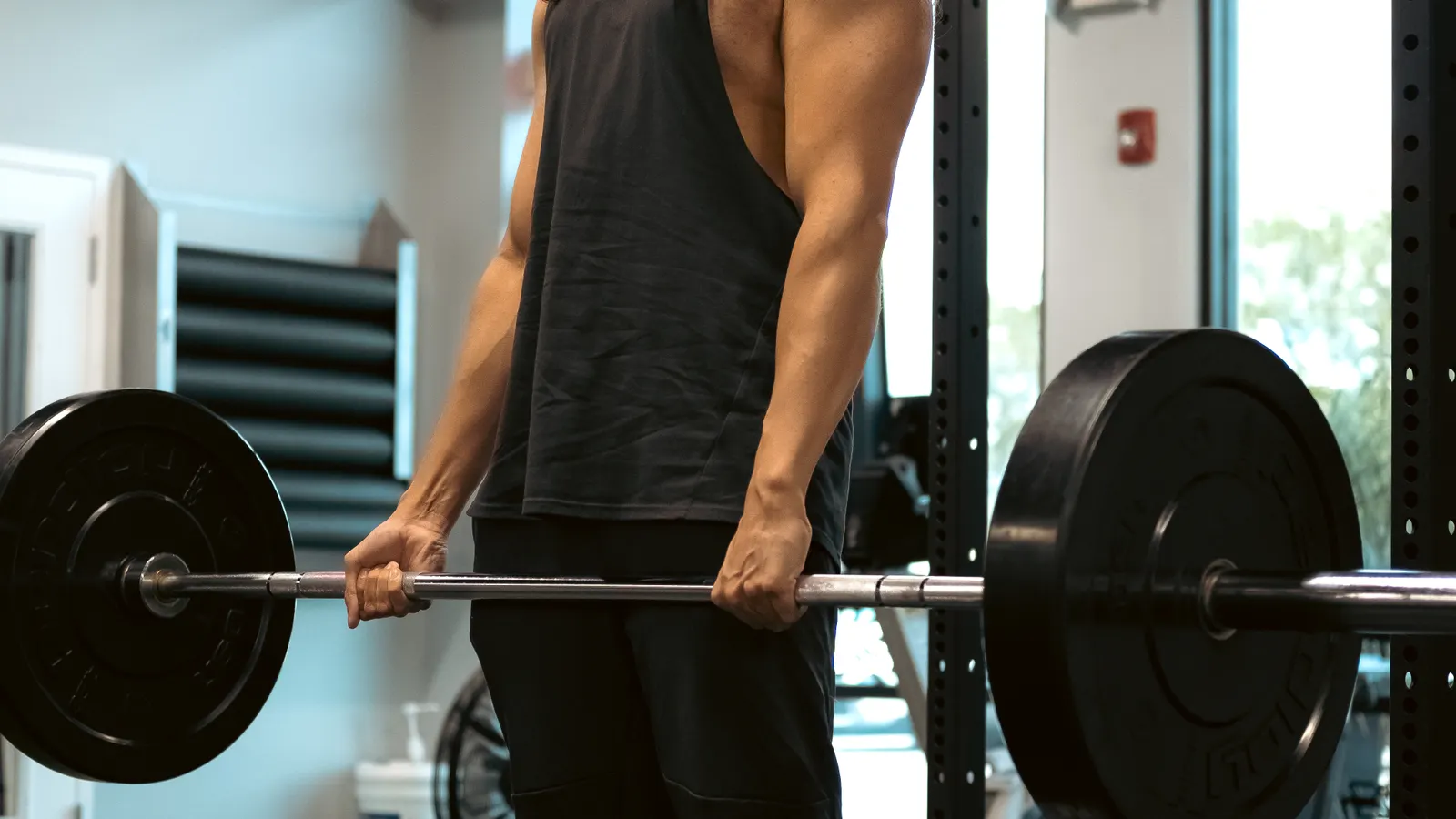Athlete performing a deadlift with a barbell