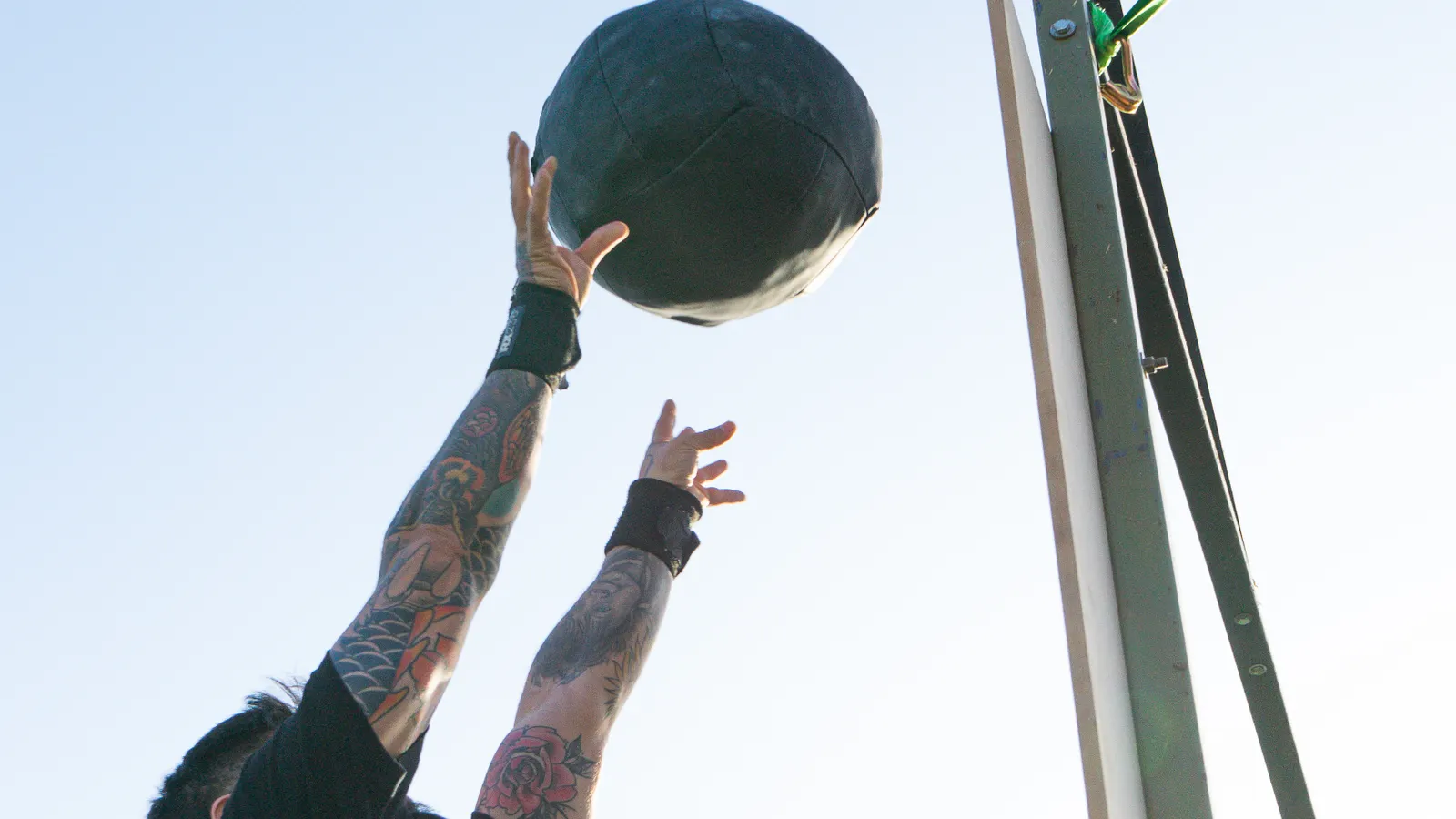 Athlete training with a medicine ball outdoors